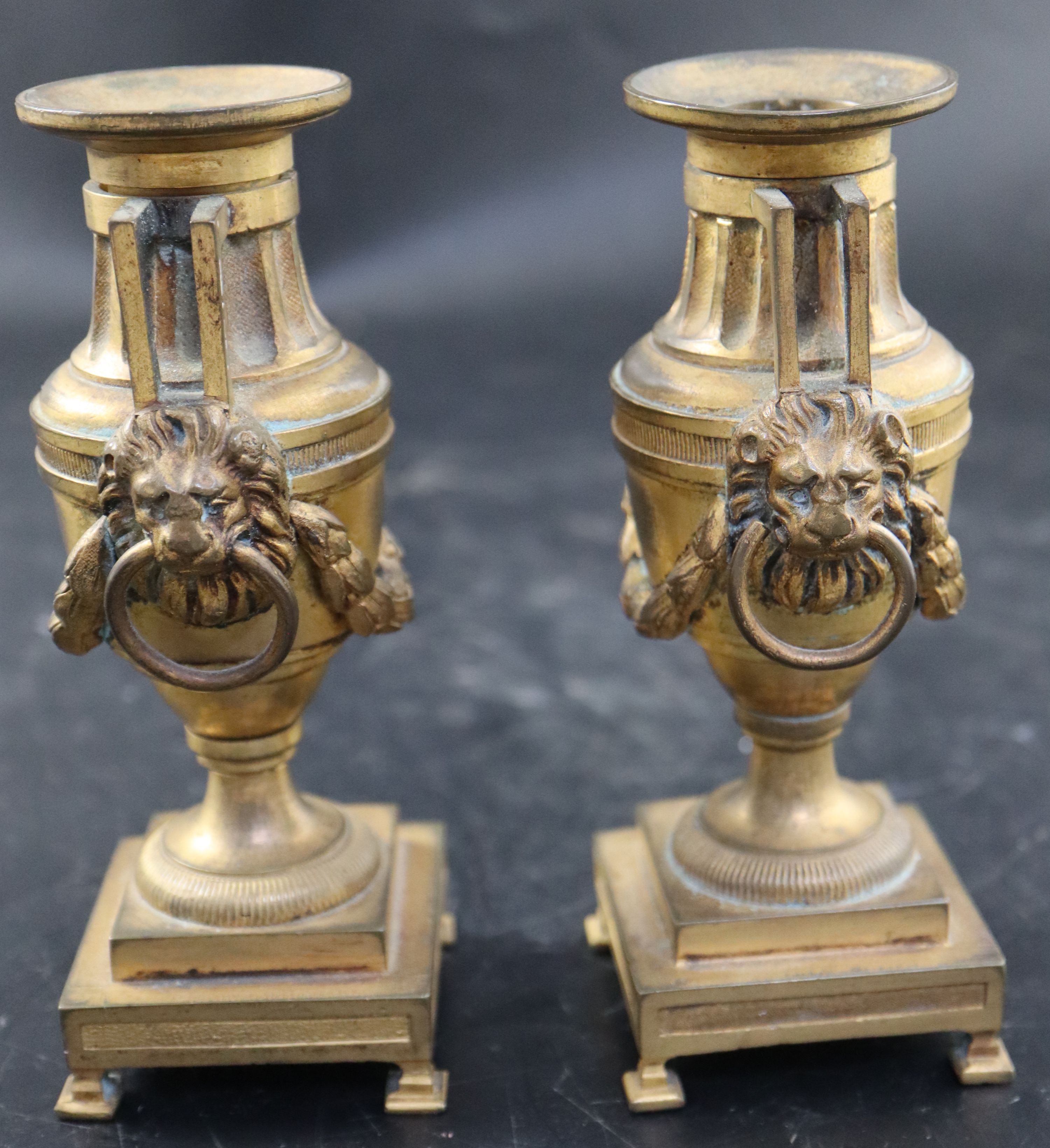 A pair of 19th century French ormolu urn shaped candlesticks, height 15cm